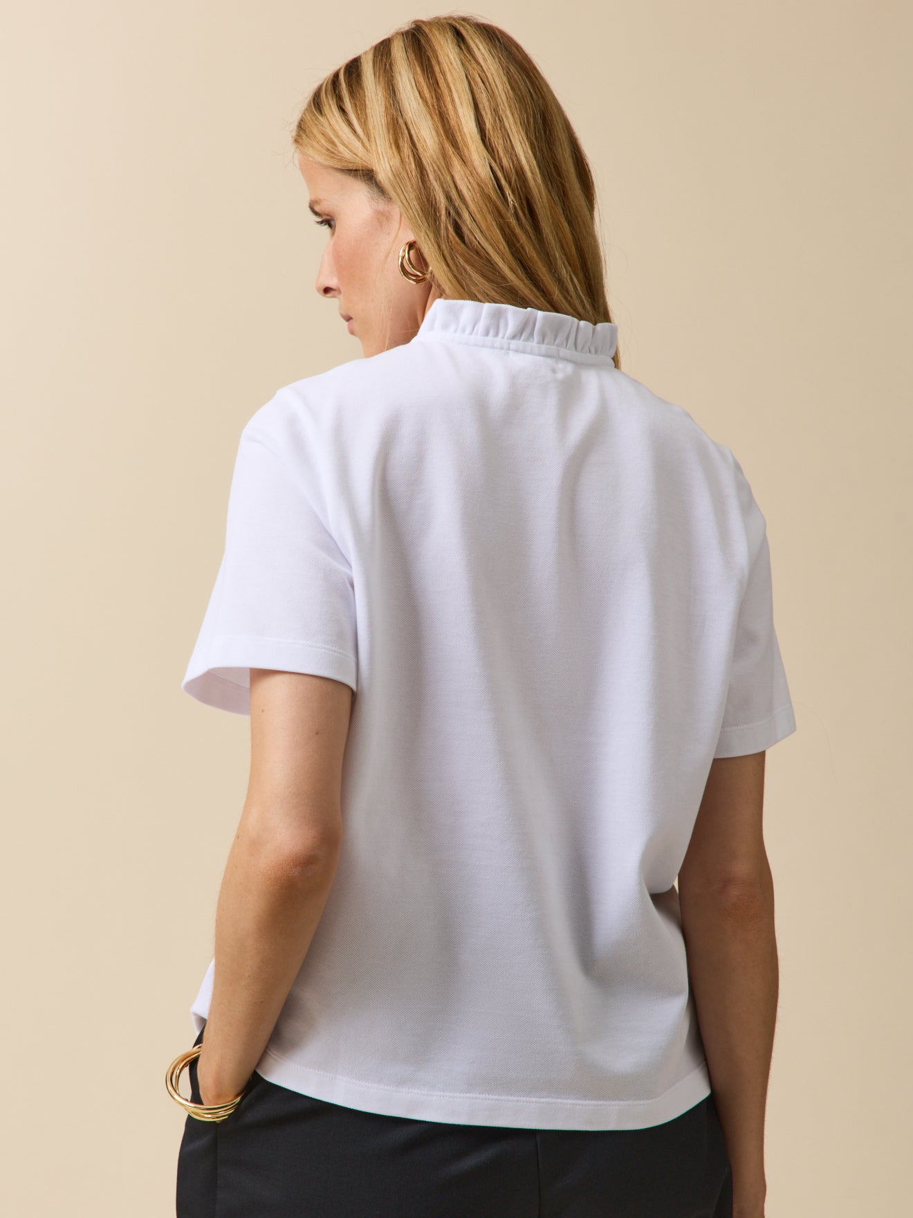 Damen-Poloshirt mit Volants am Kragen
