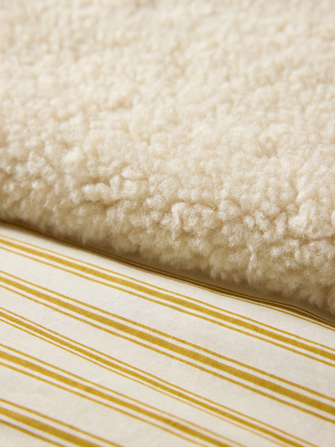 Re reversible Sherpa- und Streifen-Plaid