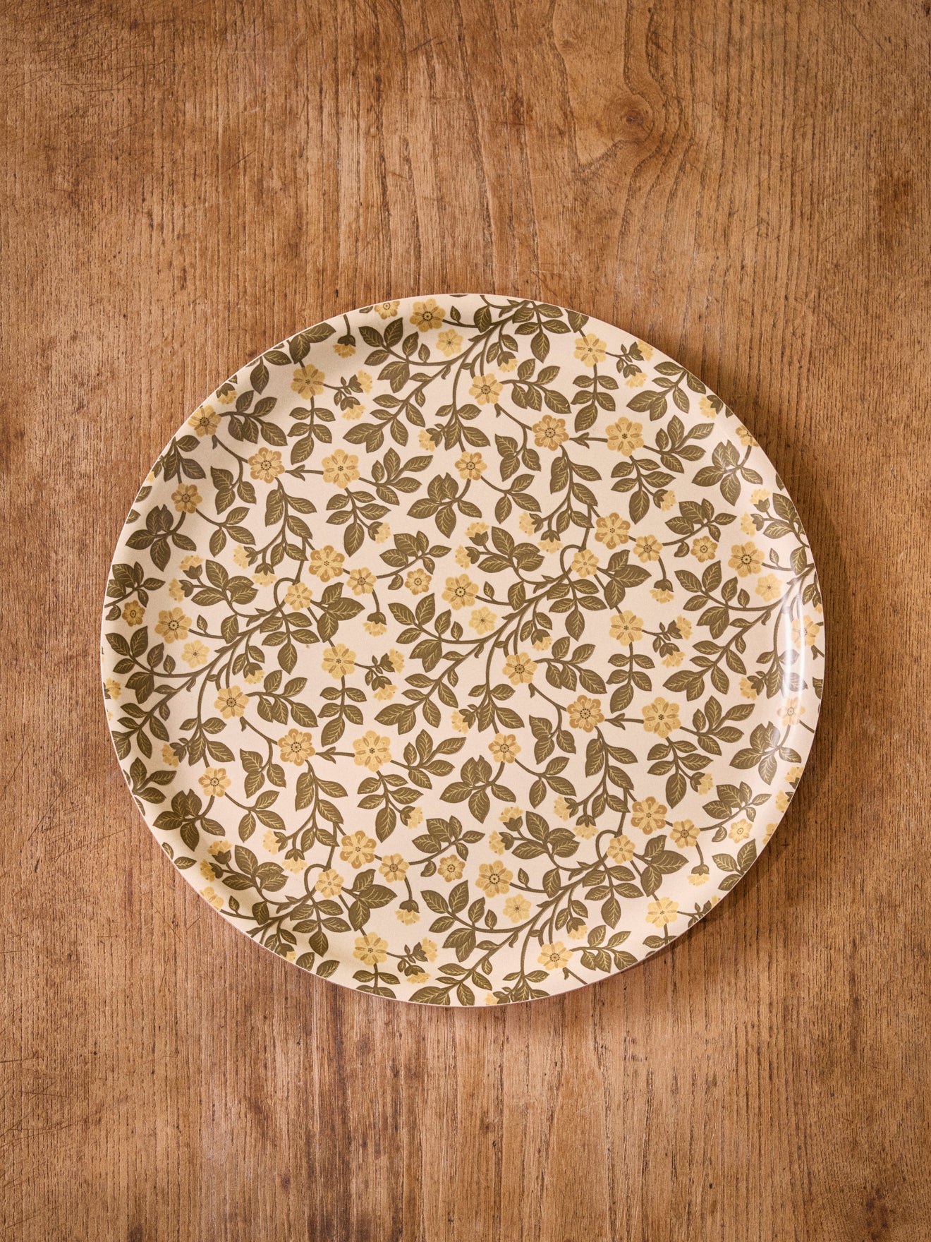 Runde Holzschale mit Blumenmotiv
